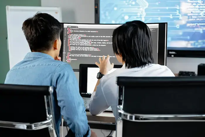 two men looking at screen